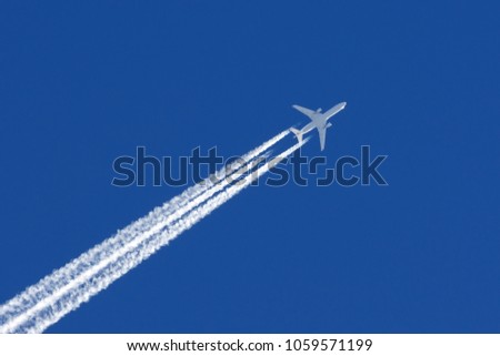 White big passenger airplane three engines aviation airport contrail clouds