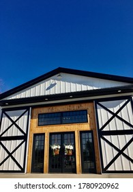 White And Black Barn Used For Wedding Venues.