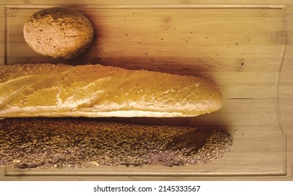 white and black breads on breadboard