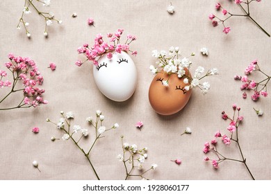 White And Black Easter Eggs With Natural Flowers Wreath On Linen Background. Zero Waste Easter Concept. Racial Equality Symbol