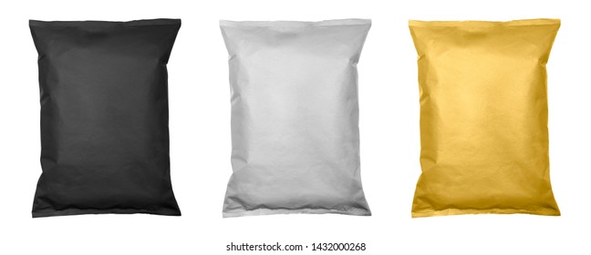 White, black and gold pillow bag of chips , snacks or candys top view. Isolated on a white background.