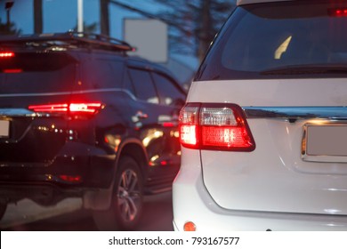 White And Black Large Luxury SUV In Traffic Jam , DOF