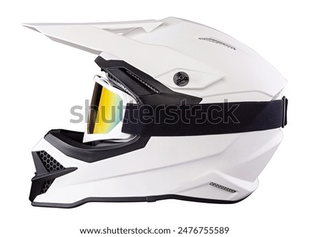 White black modern motocross or enduro downhill crash full face helmet with saftey goggles in side view isolated background.