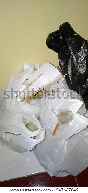 White and black plastic trash that\
contaminates the\
environment