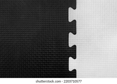 White And Black Puzzle Rubber Mat Pattern Gym Floor Background Abstract Design.