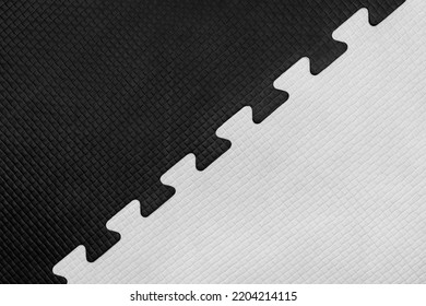 White And Black Puzzle Rubber Mat Pattern Gym Floor Background Abstract Design.