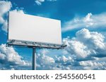 White blank billboard against blue sky with white clouds