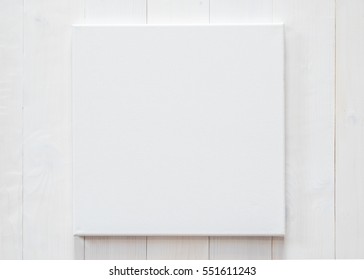 White Blank Canvas Mockup Square Size On White Wood Wall For Arts Painting And Photo Hanging Interior Decoration
