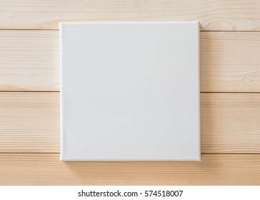 White Blank Canvas Mockup Square Size On White Wood Wall For Arts Painting And Photo Hanging Interior Decoration