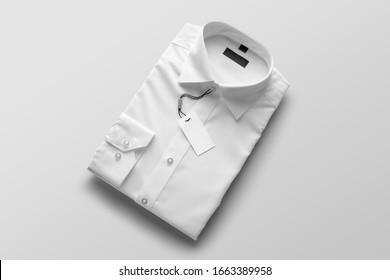 White Blank Folded Mens Shirt Mockup Template To Place Your Design, With Blank Tag Label Mockup, On A White Background. Fashion Branding Mockup Scene