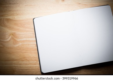 White Blank Page Sketch Book On Wood Table 