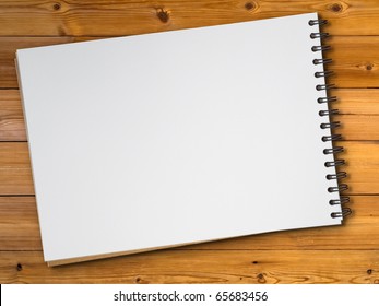 White Blank Page Sketch Book On Wood Table