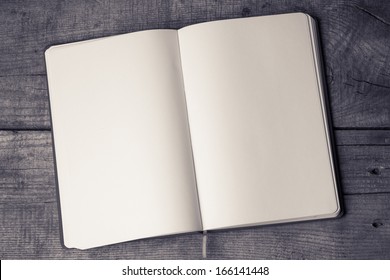 White Blank Pages Sketch Book On Wood Table Vertical  