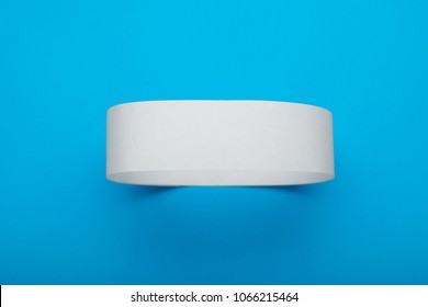 White Blank Paper Wristband, Bracelet Mockup On Blue Background.