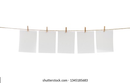 White Blank Photo Cards Hanging On Clothesline.