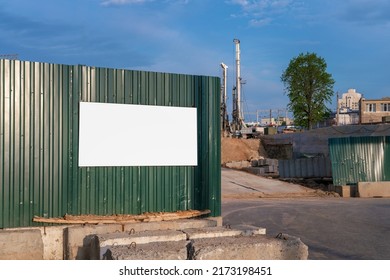 White Blank Poster With Place For Mockup Fixed On Steel Temporary Fence Of Construction Site Outdoor