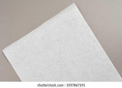 White blank sheet of baking paper on a gray background. mock up copy space