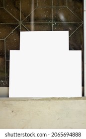 a white blank signboard Leaning against the wall for photo frame