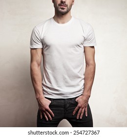 White Blank T-shirt On Handsome Athletic Man, Front, And Concrete Background