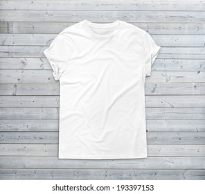 White Blank T-shirt On Wood Background