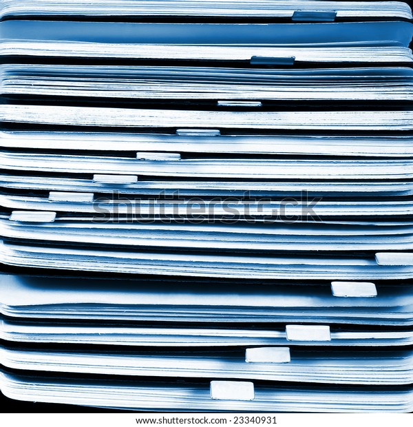 White & blue file in a filing cabinet.\
Rotary card background