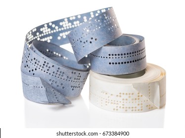 White And Blue Perforated Punched Tapes With Old Data  Is Isolated On Background, Close Up