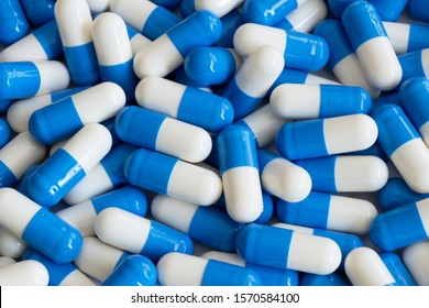 White and blue pills background. Medicine. Antibiotics