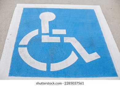 A white and blue reservation handicapped parking spot