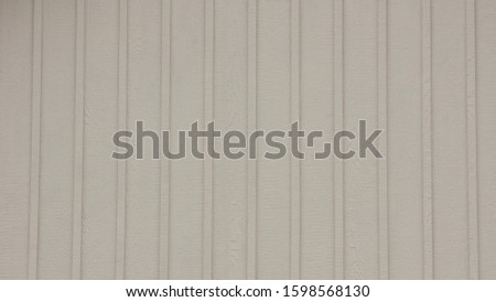 White Board and Batten exterior woodgrain vinyl siding.