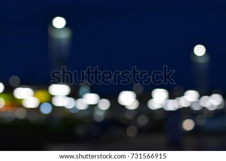 White bokeh with dark background.