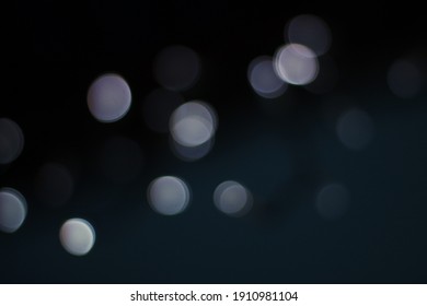 White Bokeh On Black Background