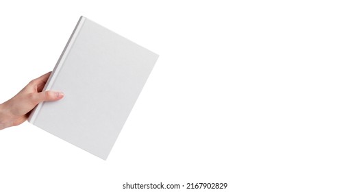 White book mock up in hand isolated on white background. Banner with literature mockup and copy space for text. High quality photo
