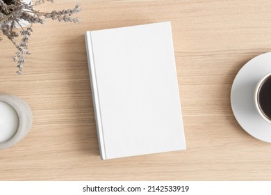White Book Mockup With A Lavender And A Cup Of Coffee On The Wooden Table.