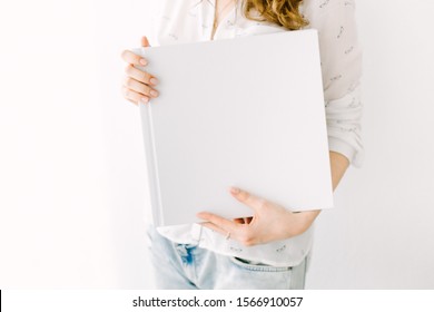 White Book Mockup. Square Empty Book. Album With Clean Pages In Hands Of Woman. Clean Book Cover Mockup