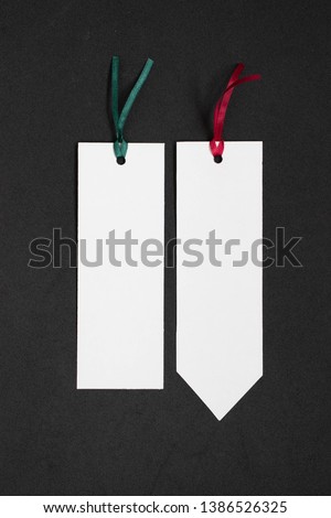 white bookmarks on a black background