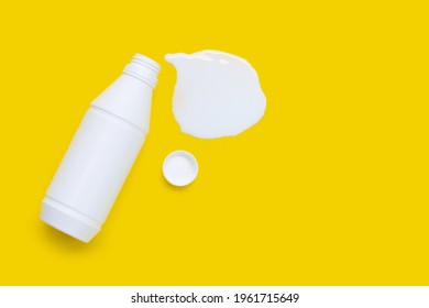 White Bottle Of Antacid Liquid On Yellow Background.