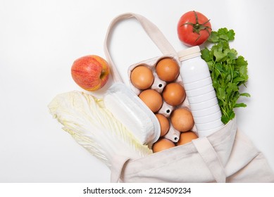 White Bottle, Apple, Tomato, Dill, Quark, Eggs In Tote Bag On White Background Spring Fresh Products Vegetables