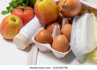 White Bottle, Apples, Onion, Tomato, Chinese Cabbage, Quark, Eggs, Dill In Tote Bag On White Background Close Spring Fresh Products Vegetables