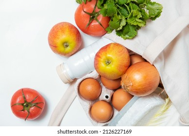 White Bottle, Apples, Onion, Tomatoes, Dill, Quark, Eggs In Tote Bag On White Background Spring Fresh Products Vegetables