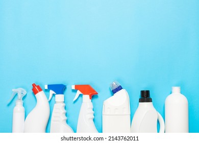 White Bottles Of Cleaning Agent On A Blue Background On The Side. Professional Cleaning Products, General Cleaning. Household Chemicals Top View