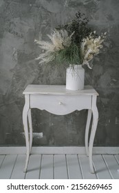 White Boudoir Table With Dried Flowers. High Quality Photo