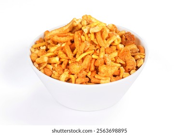 A white bowl filled with various golden and orange fried snacks sits on a white surface. The mix includes sticks, rings, and other shapes, suggesting a savory and spicy flavor. - Powered by Shutterstock