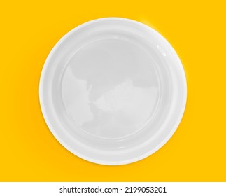 White Bowl Overhead View. Empty Ceramic Plate.
Yellow Background With A Bowl Without Content In High Resolution.