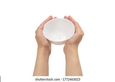 White bowl in woman hand isolated on white background.