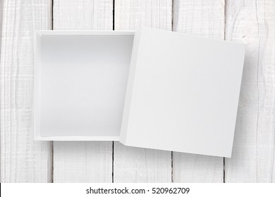 White Box With Cover On White Wooden Background