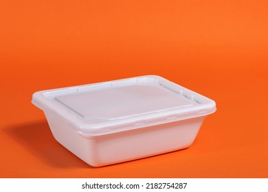 White Box Of Doshirak Noodles On An Orange Background On The Left, Fast Cheap Food, Space For Text
