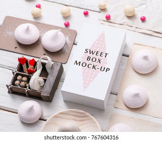 White Box Mockup Next To Different Sweets On White Table