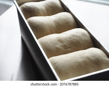 White Bread Dough In Long Loaf Baking Tin