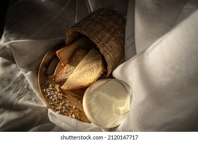 White Bread With Salt And Milk On Wooden Chopper