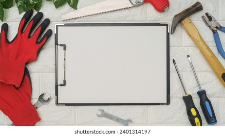 White brick background and tools.Blank paper and clipboard. - Powered by Shutterstock